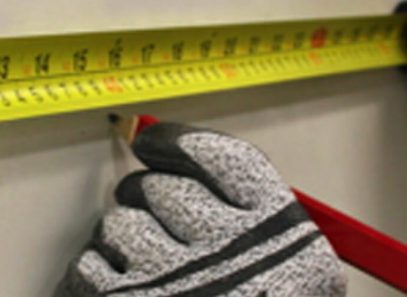 man using measuring tape