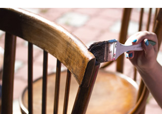 painting chair with brush