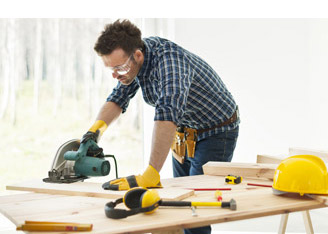 man using table saw