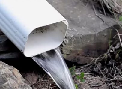 water flowing out of gutter