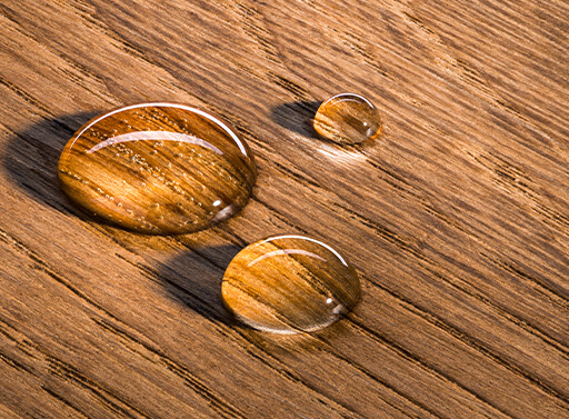 An image of water droplets on wood