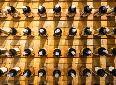 DIY Wine Rack - Timber Mart - wall mounted wine rack with pegs supporting bottles of wine.